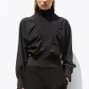 top à plastron smocké